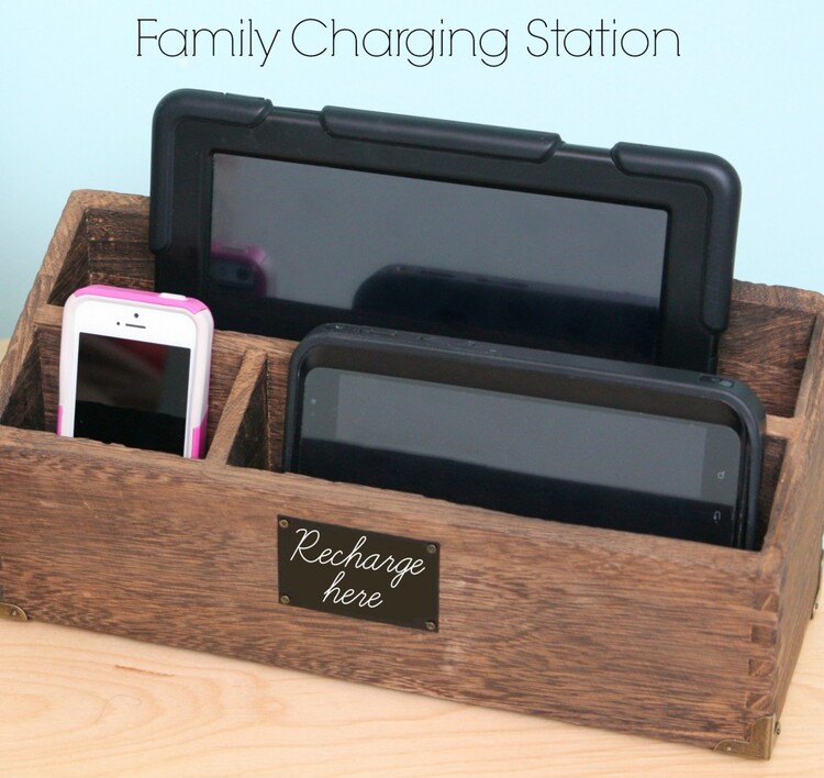 wooden mail organizer with tablets and cellphones stored