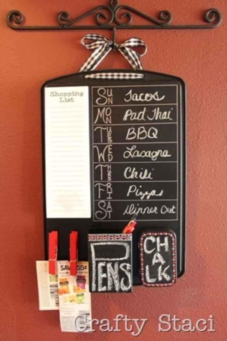 A super cool kitchen command center made from a cookie sheet complete with coupons and clothespins 