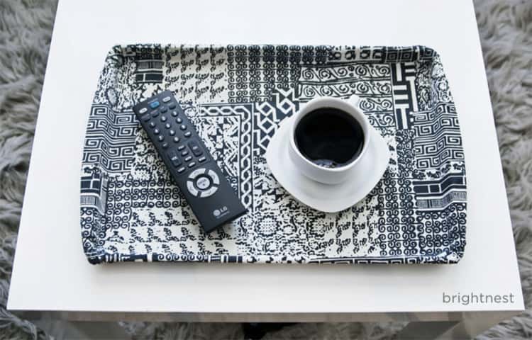 An old cookie sheet turned into a lovely serving tray with some fabric and spray adhesive