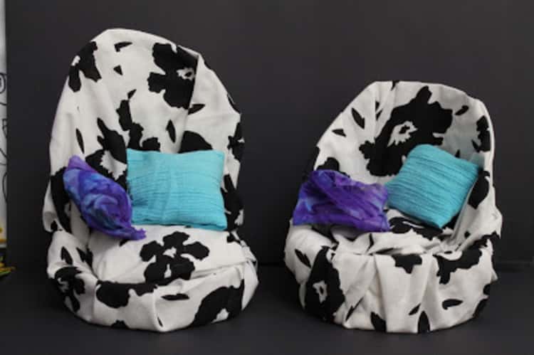 little seats with a high back cut from oatmeal containers covered with fabric and tiny pillows meant for dolls