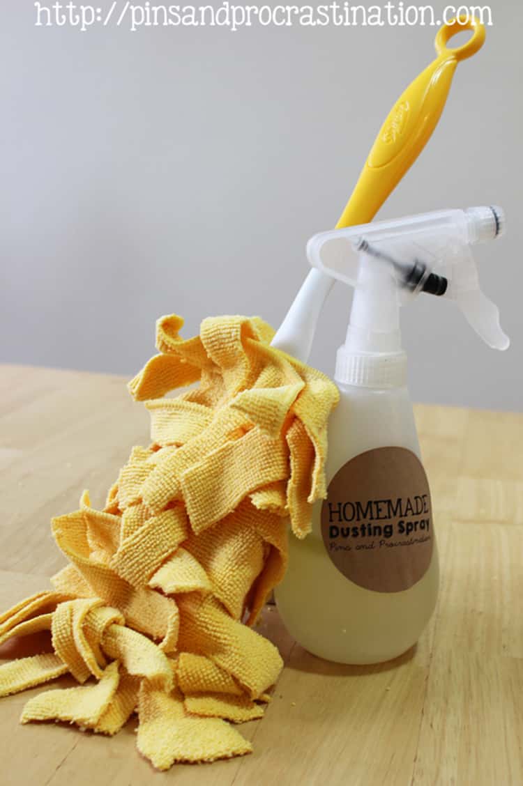 dusting hacks - a DIY no-sew duster fixed on a Swiffer duster handle and leaning against a bottle of homemade dusting spray