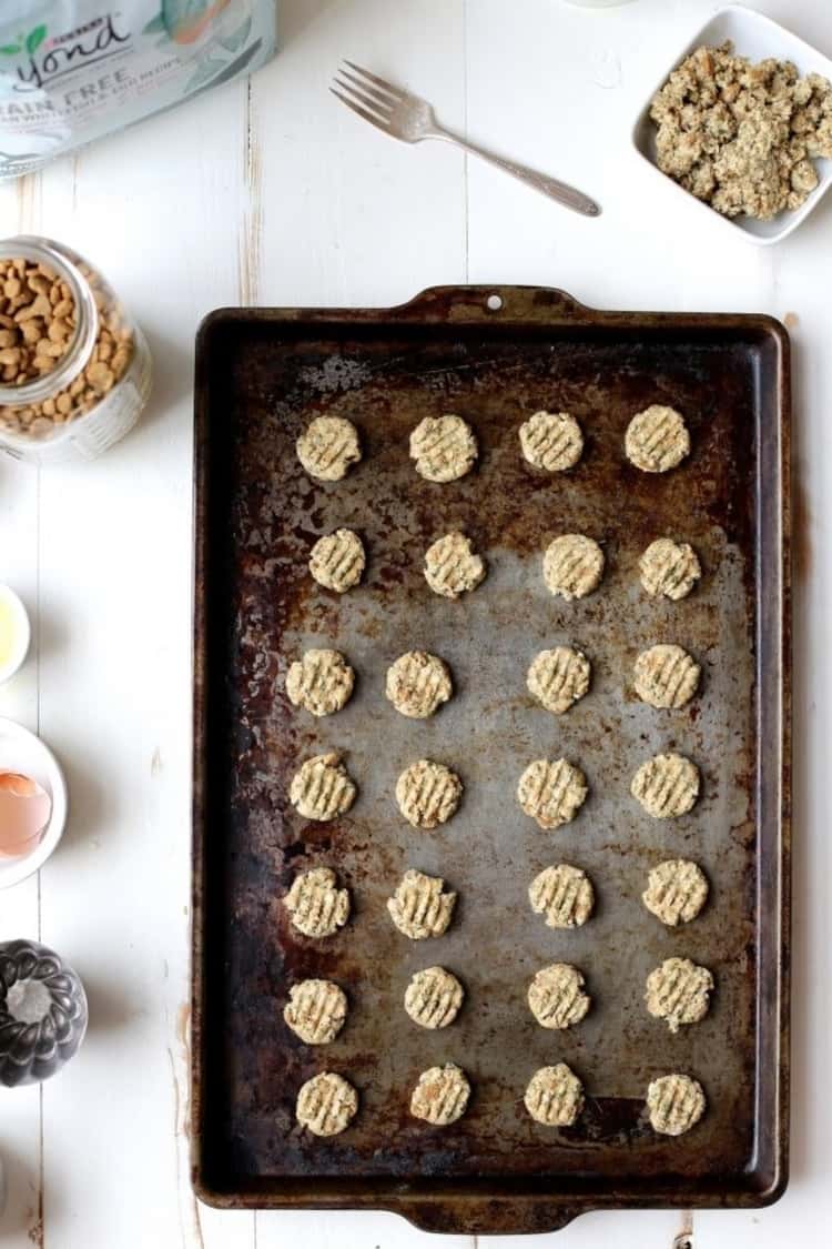 a baking sheet of homemade salmon and oat cat treats