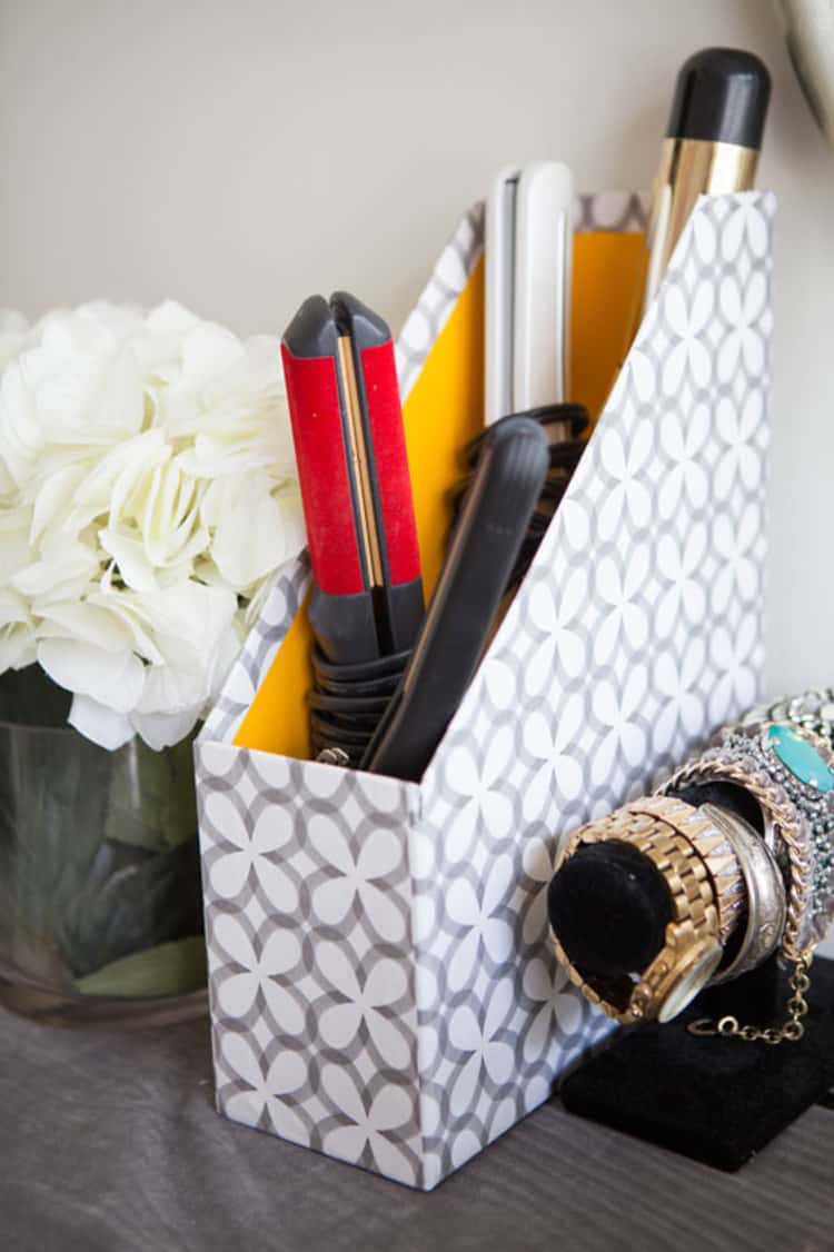 hot styling tools organized in a magazine holder 