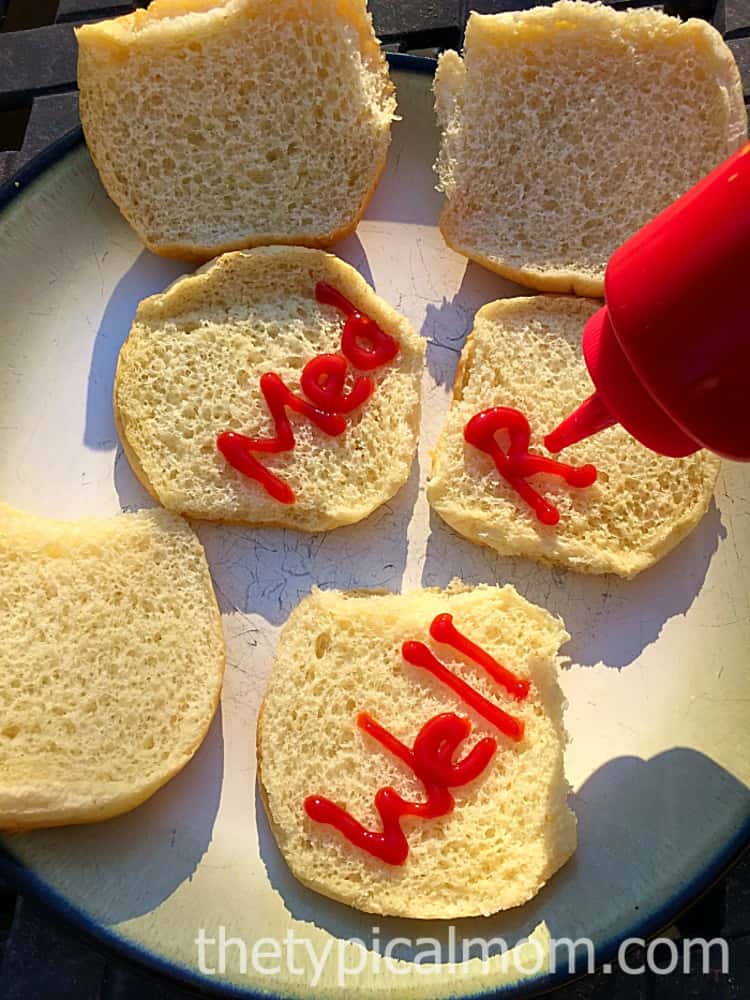 Use ketchup to mark the buns