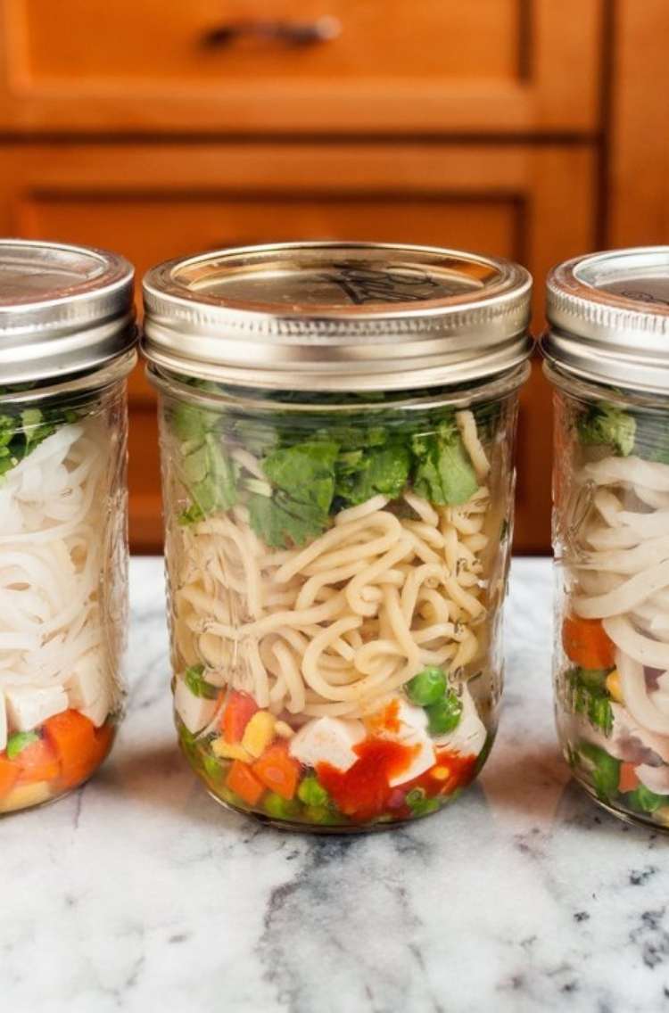 Ramen: three jars filled with noodles, colorful veggies, and other toppings