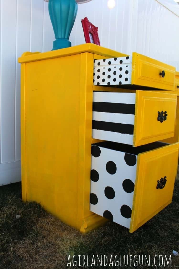 desk makeover with fresh coat of paint and drawers whose sides have been painted in a different color with fun designs using stencils