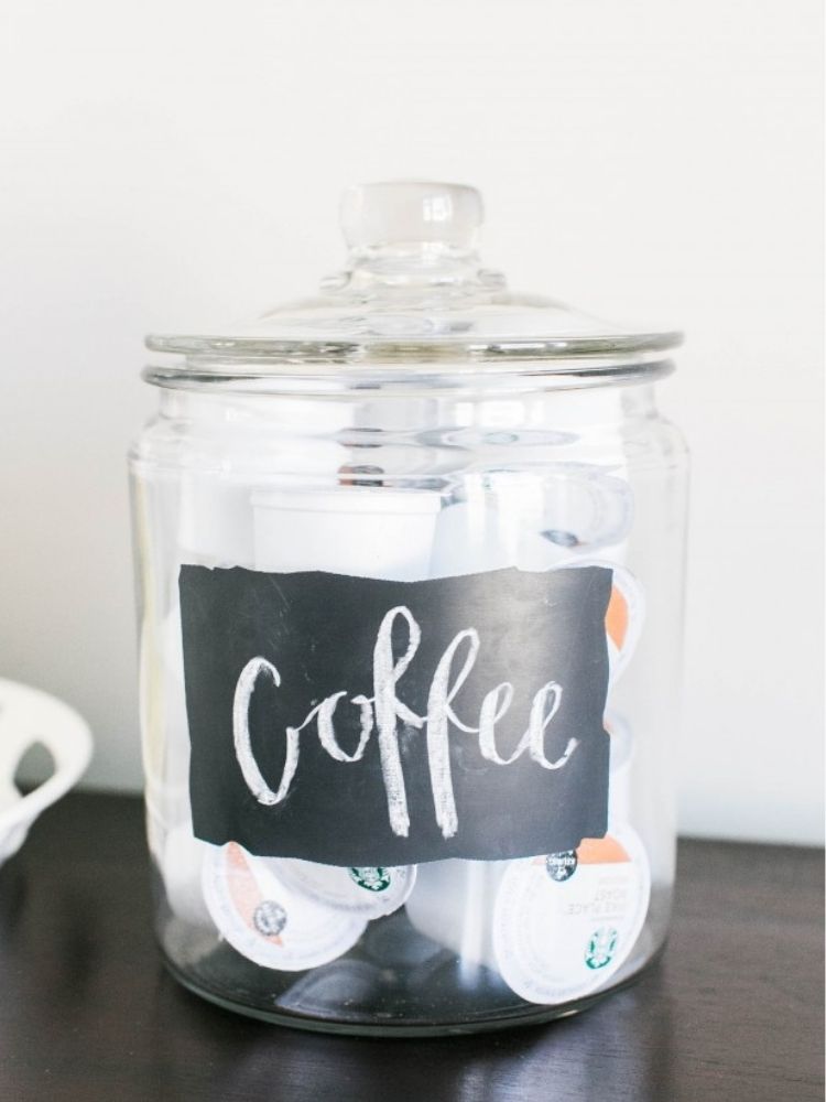 coffee pods in a glass jar with a chalk board label