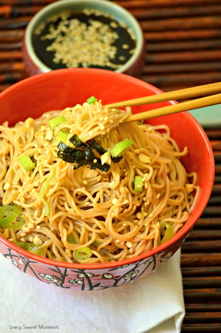 Ramen Noodles tossed in peanut soy sauce in a ceramic bowl with chopsticks