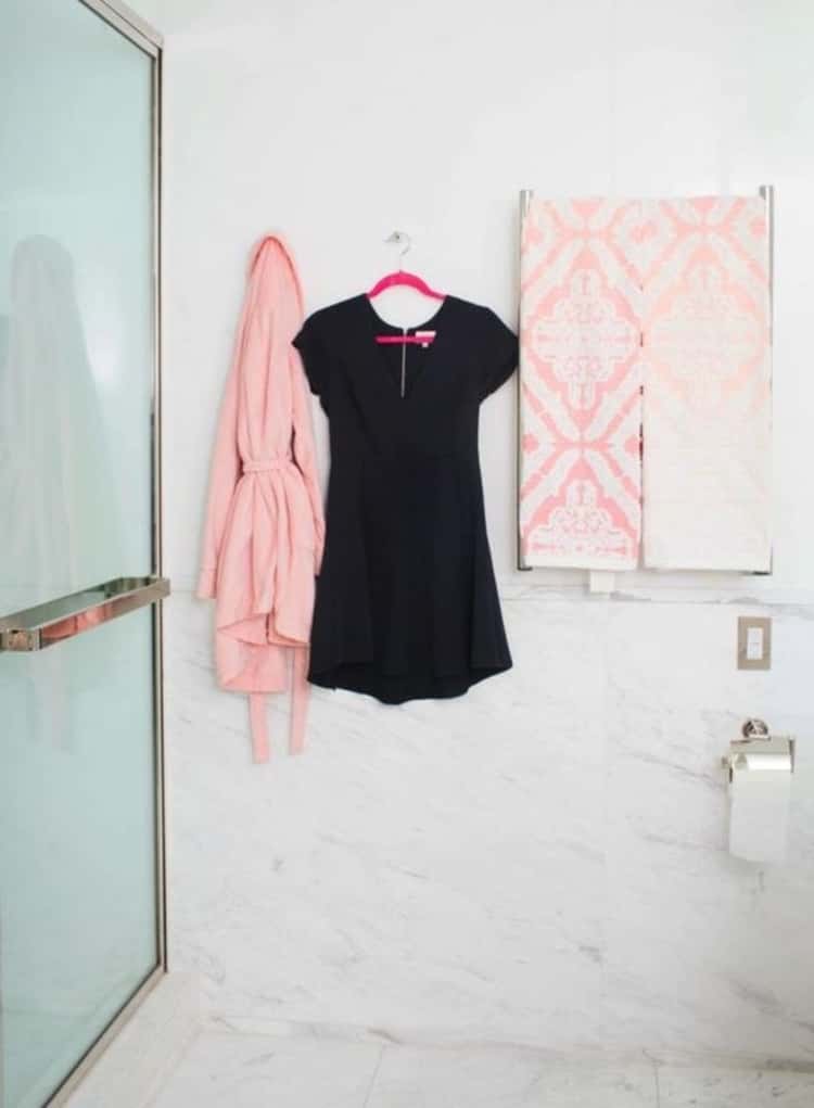 shower hacks - clothes hang in shower cubicle to steam while you take a shower