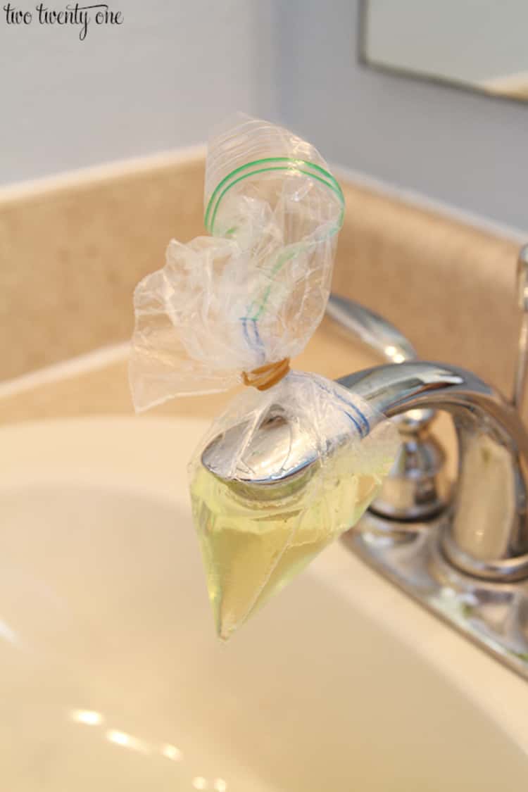 stain removal hacks - faucet covered in plastic bag with a solution of equal parts CLR and water