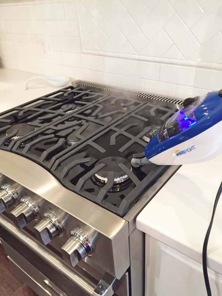 Clean the stove burners using a steam cleaner