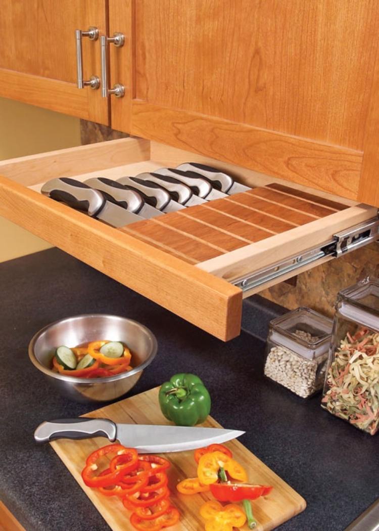 This perfectly sized cabinet drawer holds knives and keeps your counter clear for much needed room in tiny kitchens.