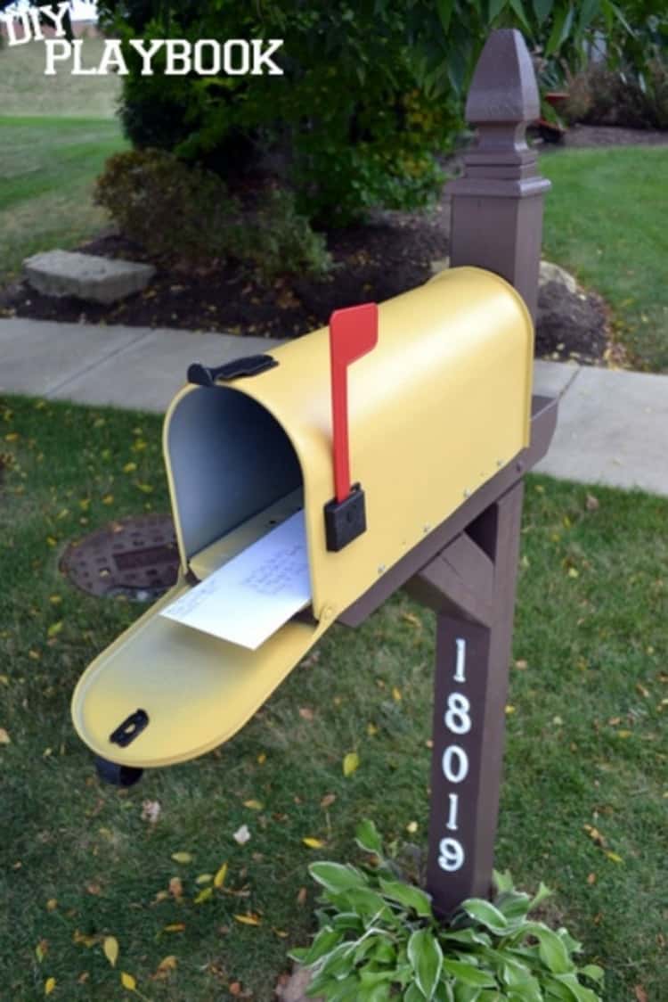mailbox makeovers - mailbox painted in a happy yellow color on a bark brown post