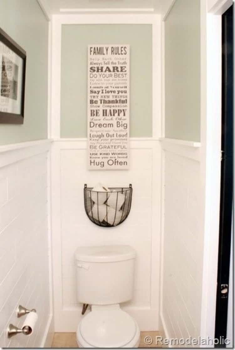 bathroom toilet paper storage using wire basket above the toilet