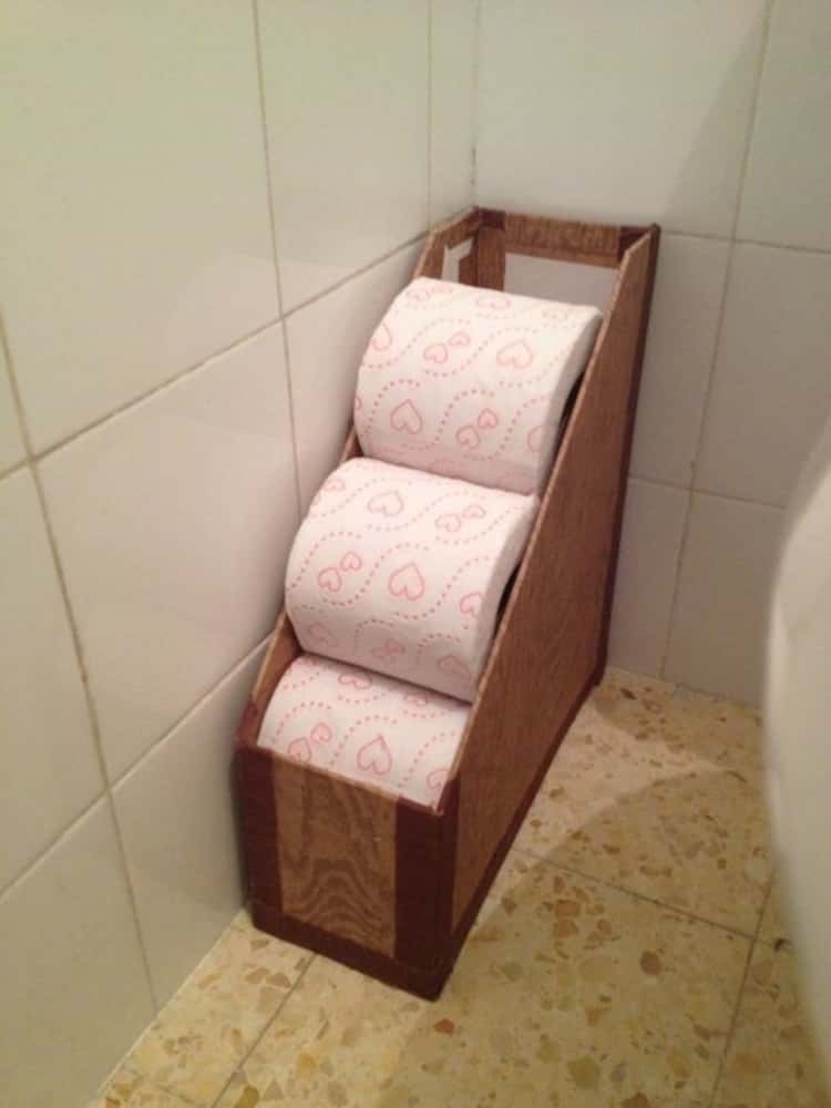 https://www.onecrazyhouse.com/wp-content/uploads/2021/06/05-magazine-holder-repurposed-to-store-toilet-paper-rolls-in-bathroom.jpg