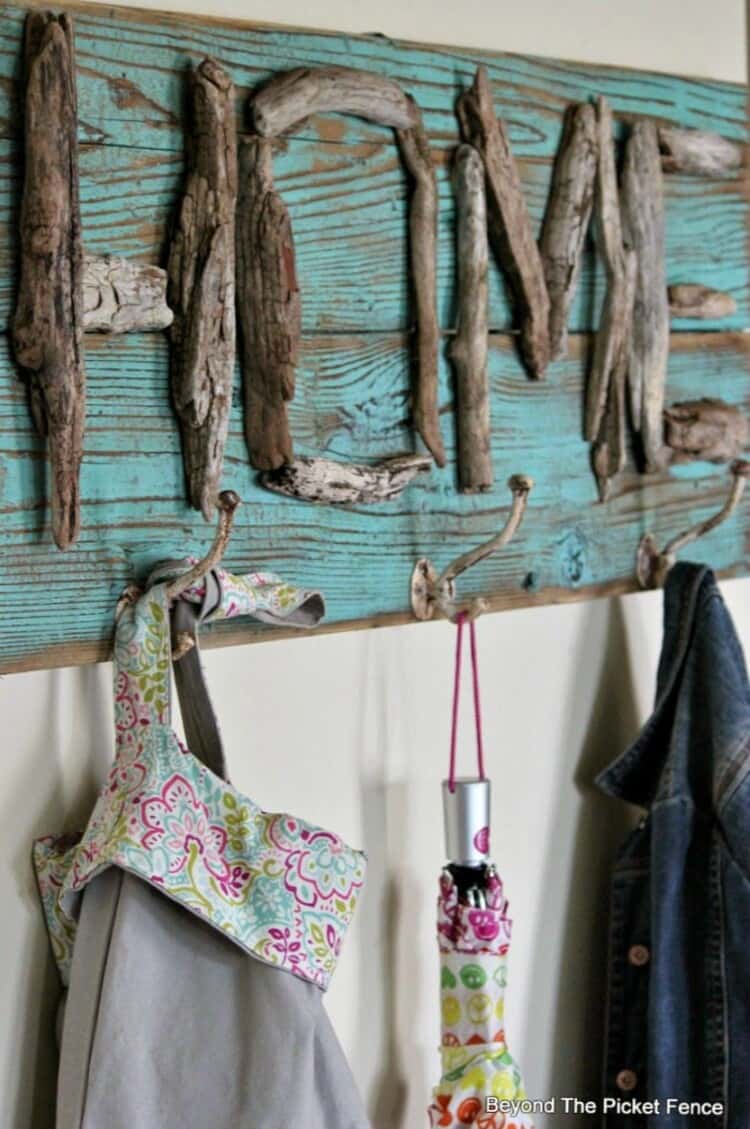 DIY coat rack with home sign and hooks attached