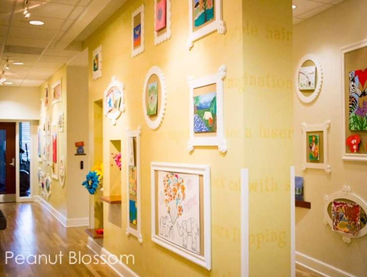 OneCrazyHouse kid friendly living room ideas Hallway with framed cork boards displaying kids artwork