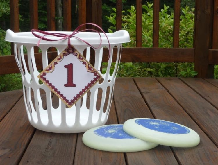 2 glow in the dark frisbees with a basket