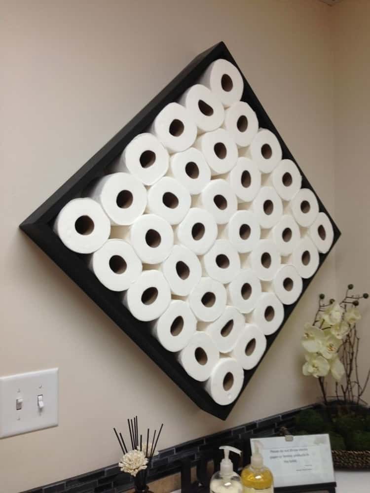 toilet paper storage holder art using a stained or painted box on the wall