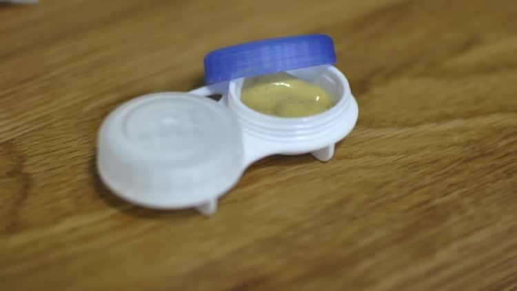 contact lens container filled with mustard