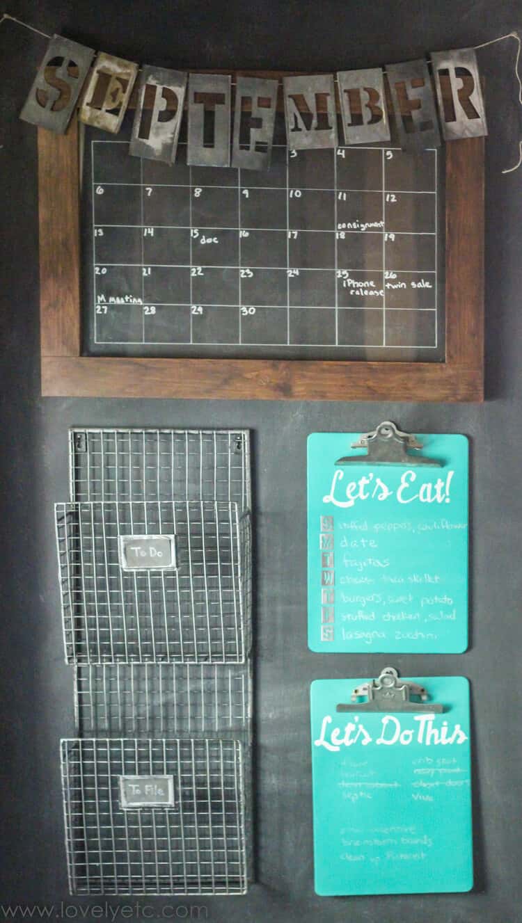 Industrial Look Command Center with a calendar with reclaimed wood backsplash, wire magazine holders and folder clips