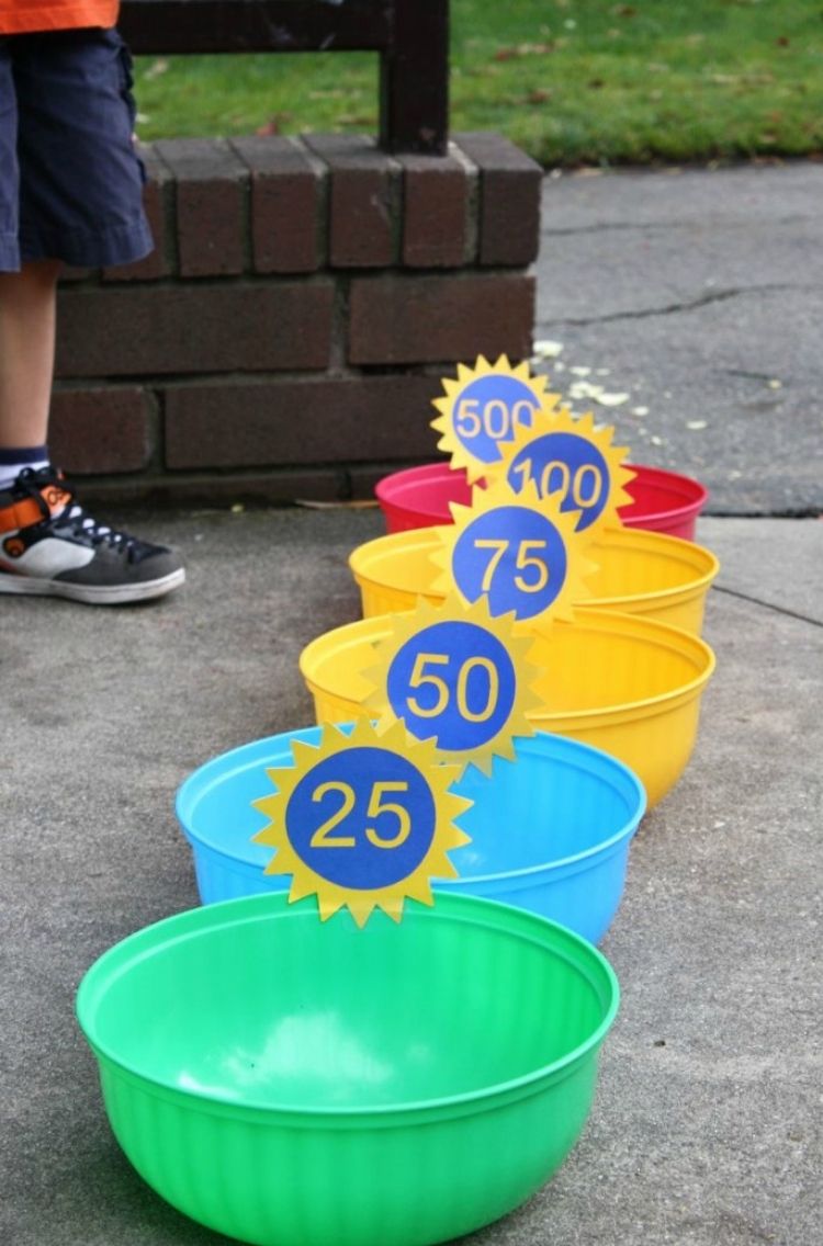 5 multi colored pails with numbers attached for points