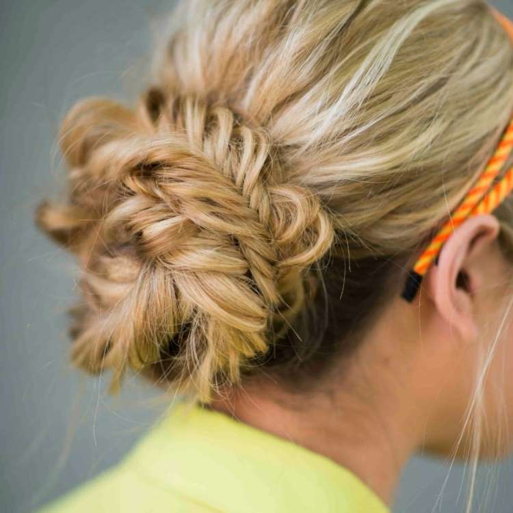 easy bun ideas for summer, blonde woman's hair with a bun in the back