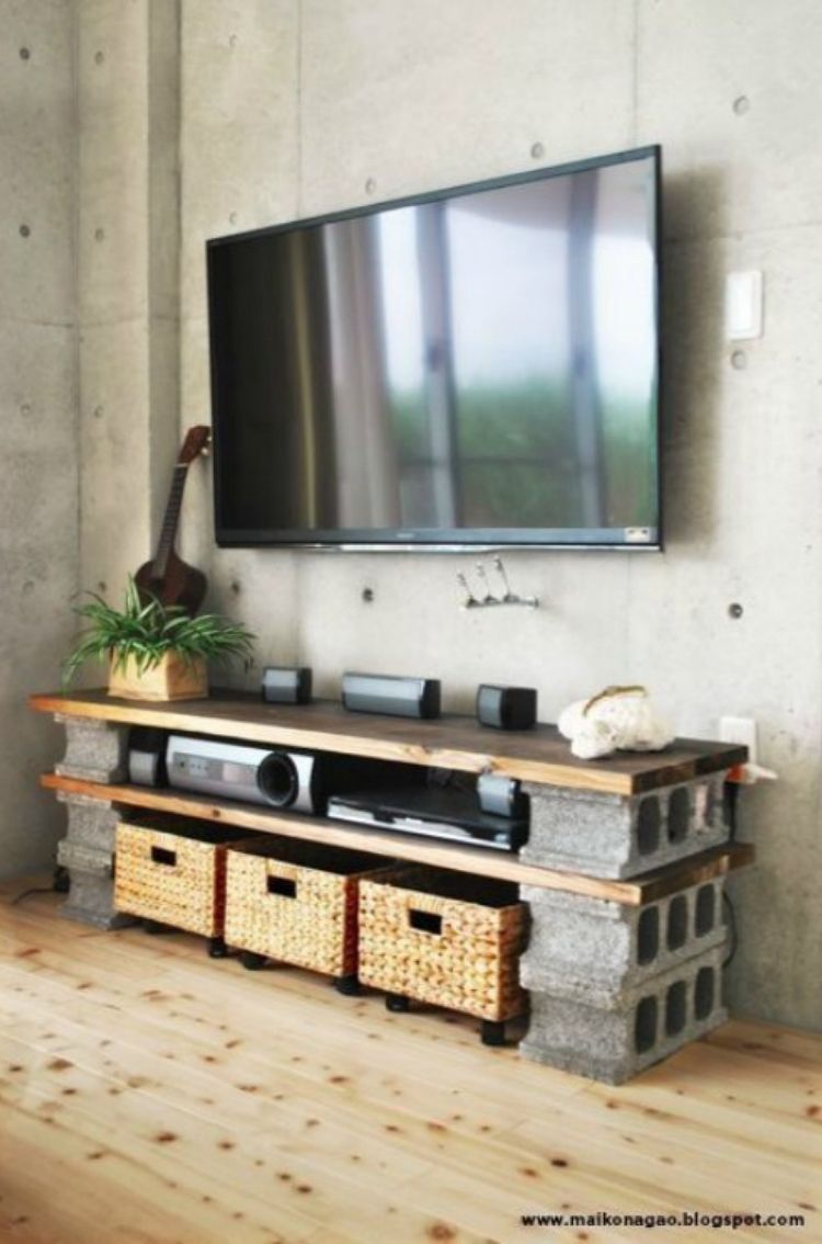 What a class way to upcycle cinder blocks into a wood and rock looking entertainment center. 