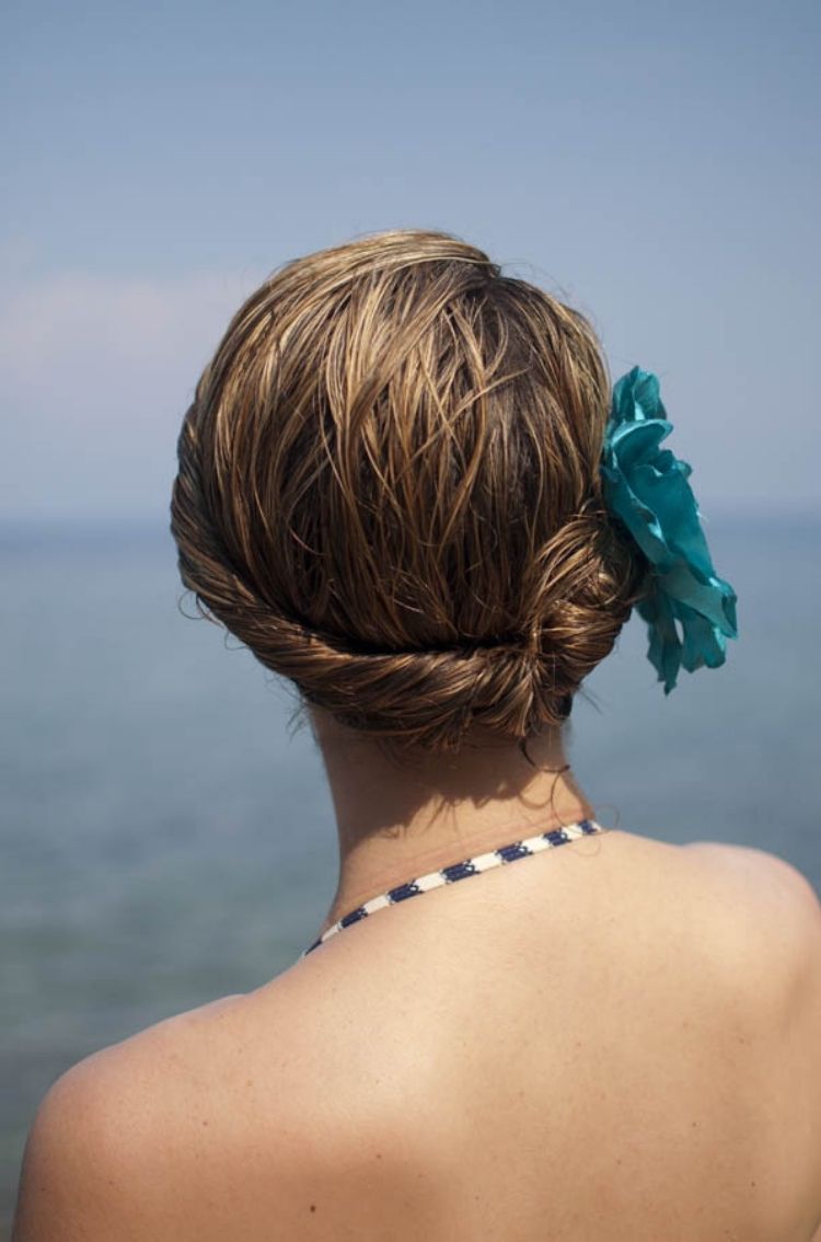 When you want great looking Summer Beach Hair but your hair is still wet, use this fast roll up idea and stick a blue flower clip in your hair.