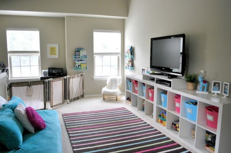 Create a custom entertainment center by putting together multiple cubby units.