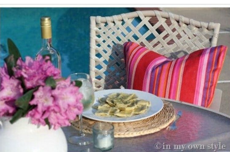 We love colorful deck ideas. Here we have a lovely striped red and pink deck pillow. 