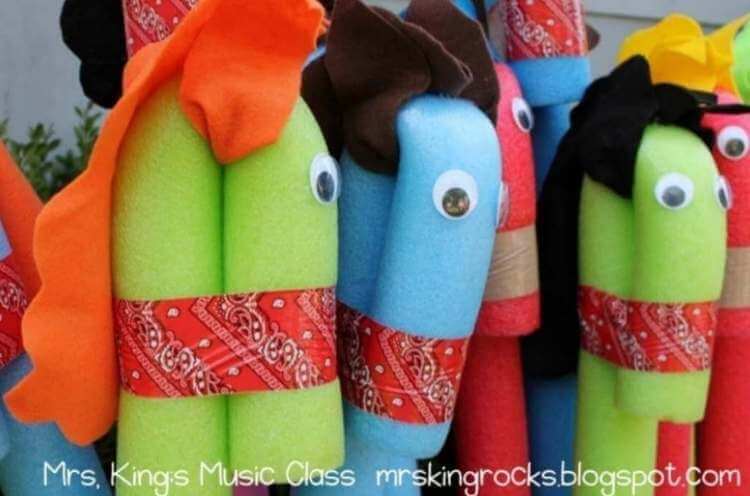 Cute uses for pool noodles- colorful party favor ponies with wiggly eyes made from pool noodles