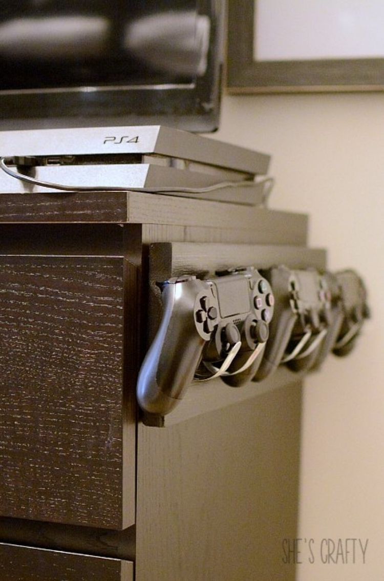 Pick yourself up some hooks from the Dollar Store and use them to hang your video game controllers up and out of your way. 