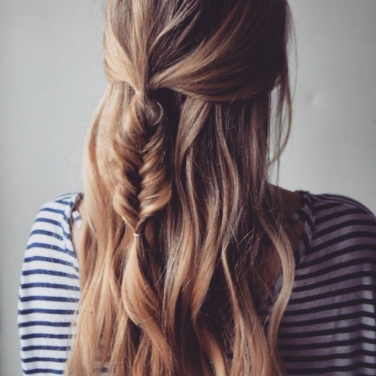 This half up, half down, fishtail braid pulls your hair out of your face but will keep your hair elegant and flirty at the beach.