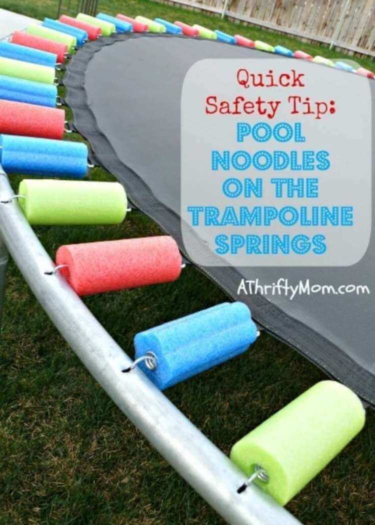 uses for pool noodles- a Trampoline with its springs covered in colorful pieces of pool noodles cut to the correct length to cover each spring