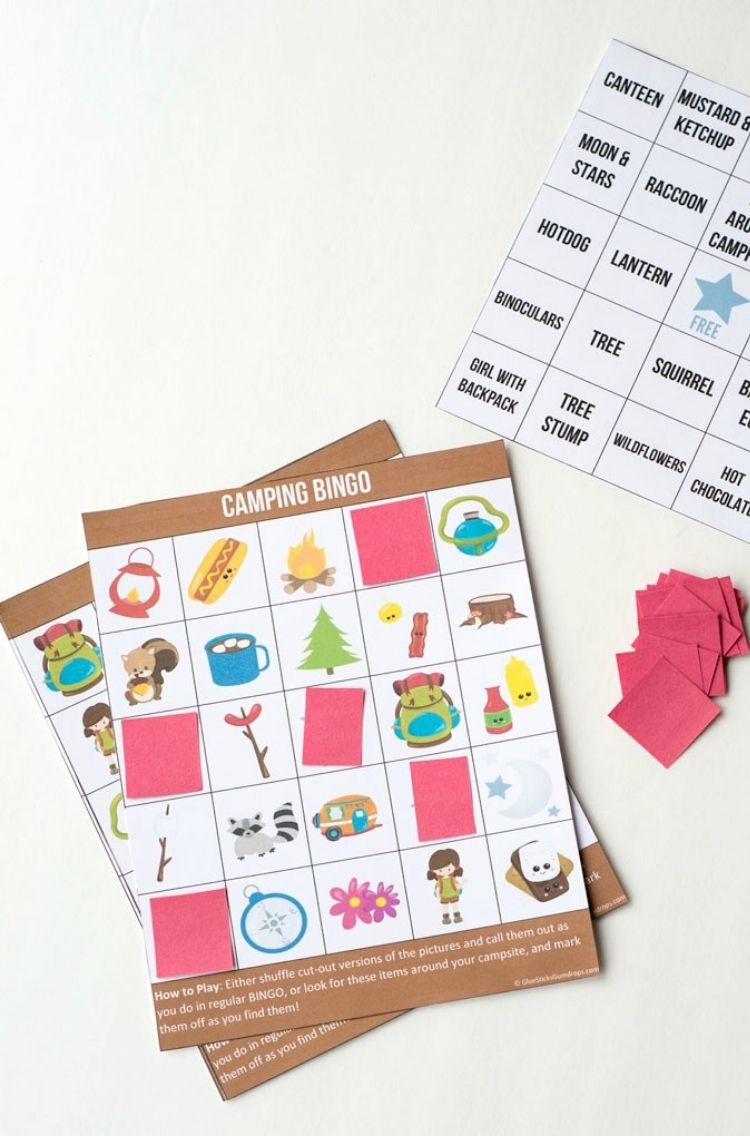 camping bingo game with cute images and red color paper to cover image