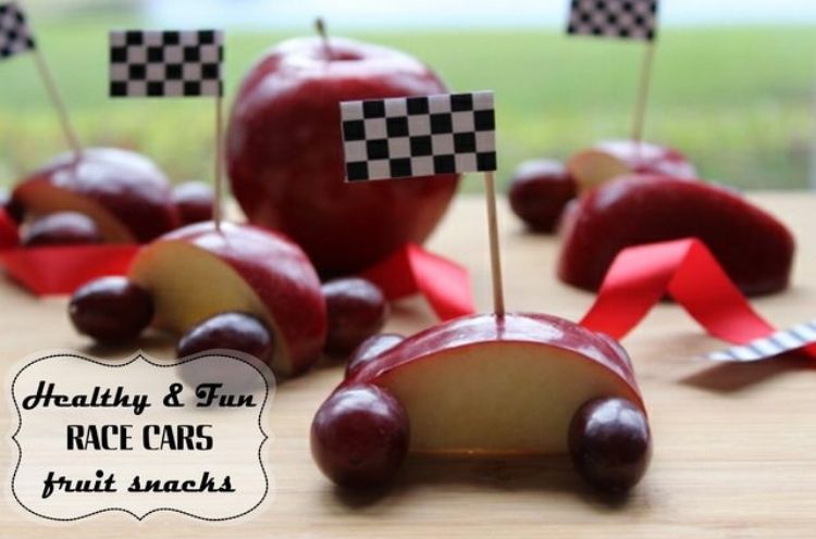 The hardest part about this way to serve fruit to your kids is getting them not to play with their food. Race cars made of apple slices and grapes is hard not to race. 