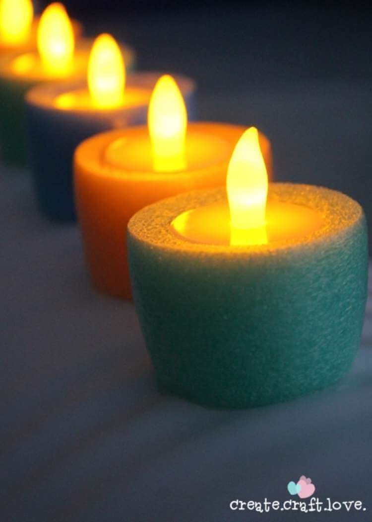 uses for pool noodles- floating candles made from tea lights and short pieces of pool noodles 