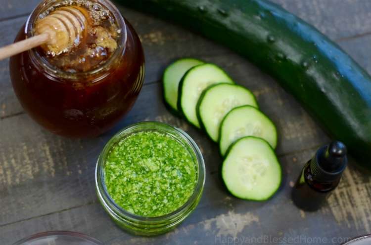 15 Moisturizing Tricks for Super Dry Skin
 - Homemade Cucumber Sugar Scrub in a Jar on a wooden table, next to a jar of honey, a cucumber, and cucumber slices - One Crazy House