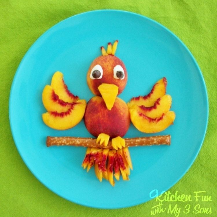 This pretty as a peach parrot is almost to good to eat but your kids will love it and it's a fun way to serve fruit to your kids.