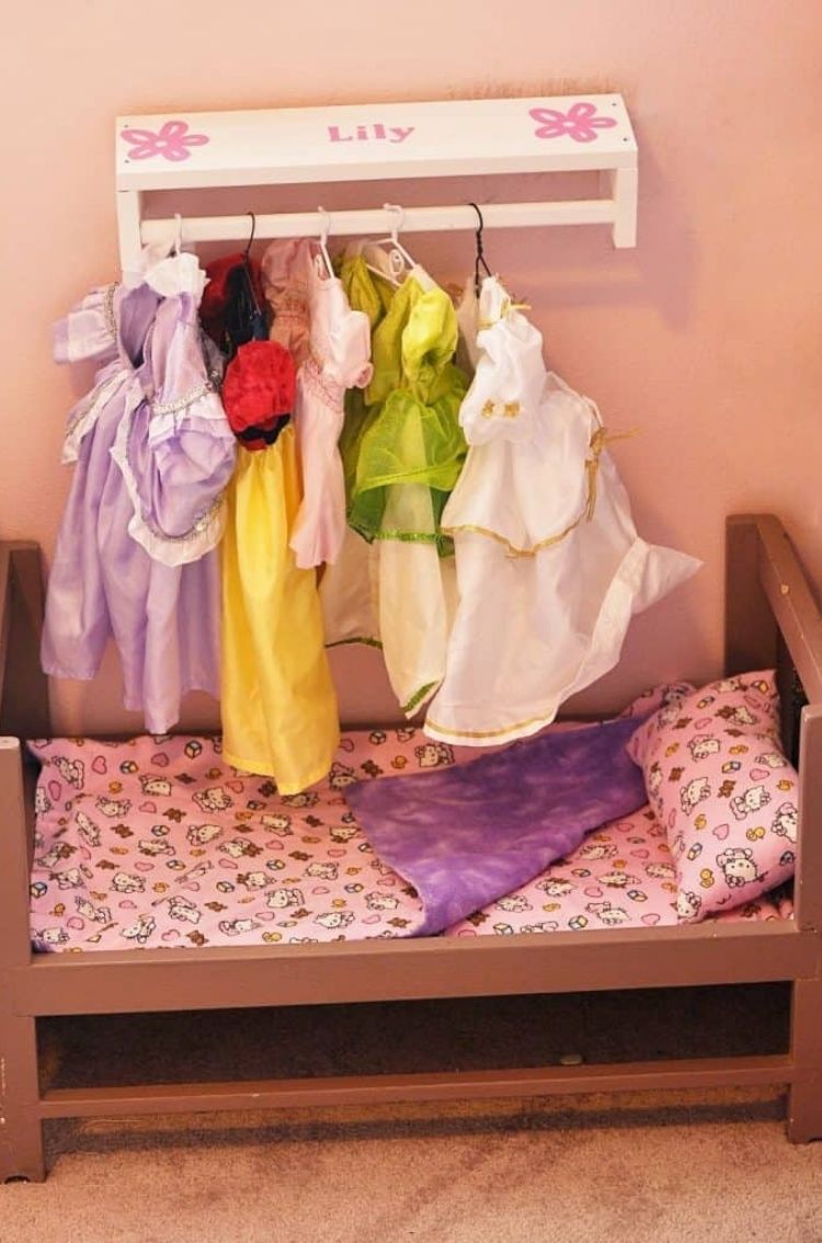 Repurpose old spice racks into a wall closet for your child's doll clothes. 