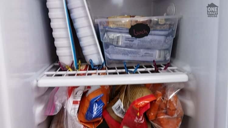 an open refrigerator showing a neat arrangement of the food stuff