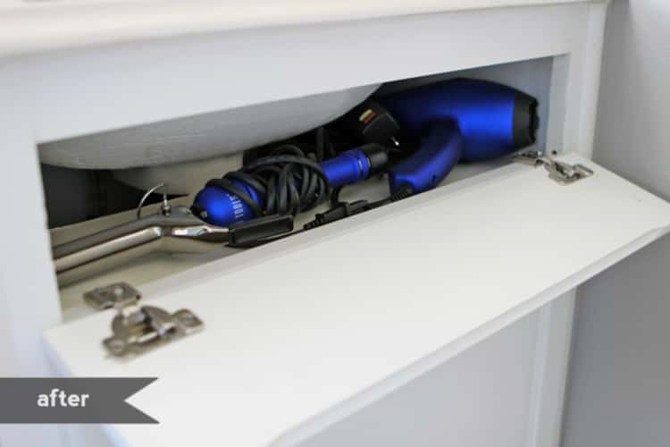 Hair dryer and tongs storage drawer underneath sink