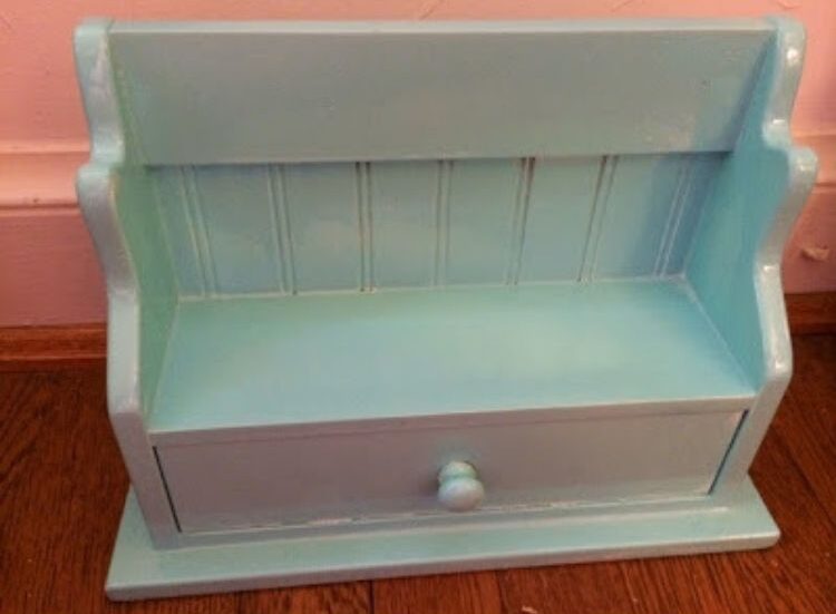 Create the perfect furniture for the dolls in your house by painting your old spice rack.