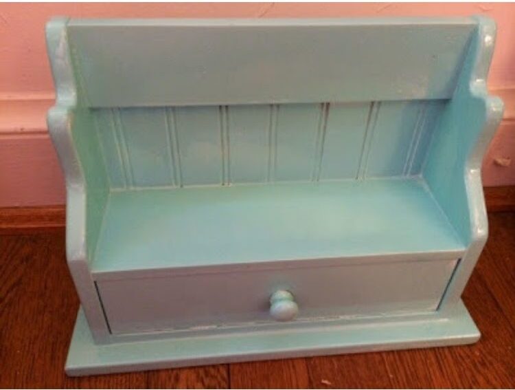 Create the perfect furniture for the dolls in your house by painting your old spice rack.