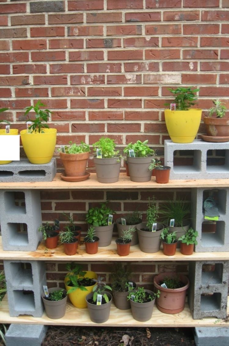 Cinder Blocks make great storage cubbies and planter stands for your outdoor space. 