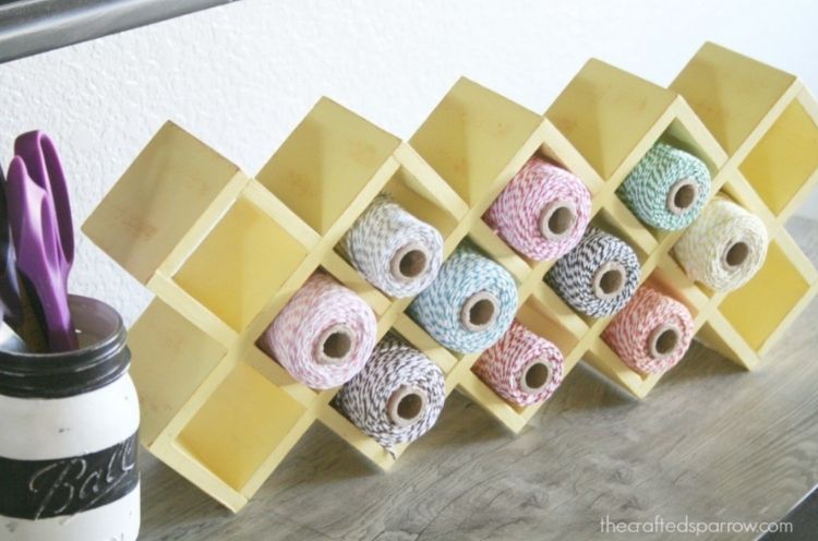Use this great idea and turn your old spice rack into a place to store all your twine in your craft room. 