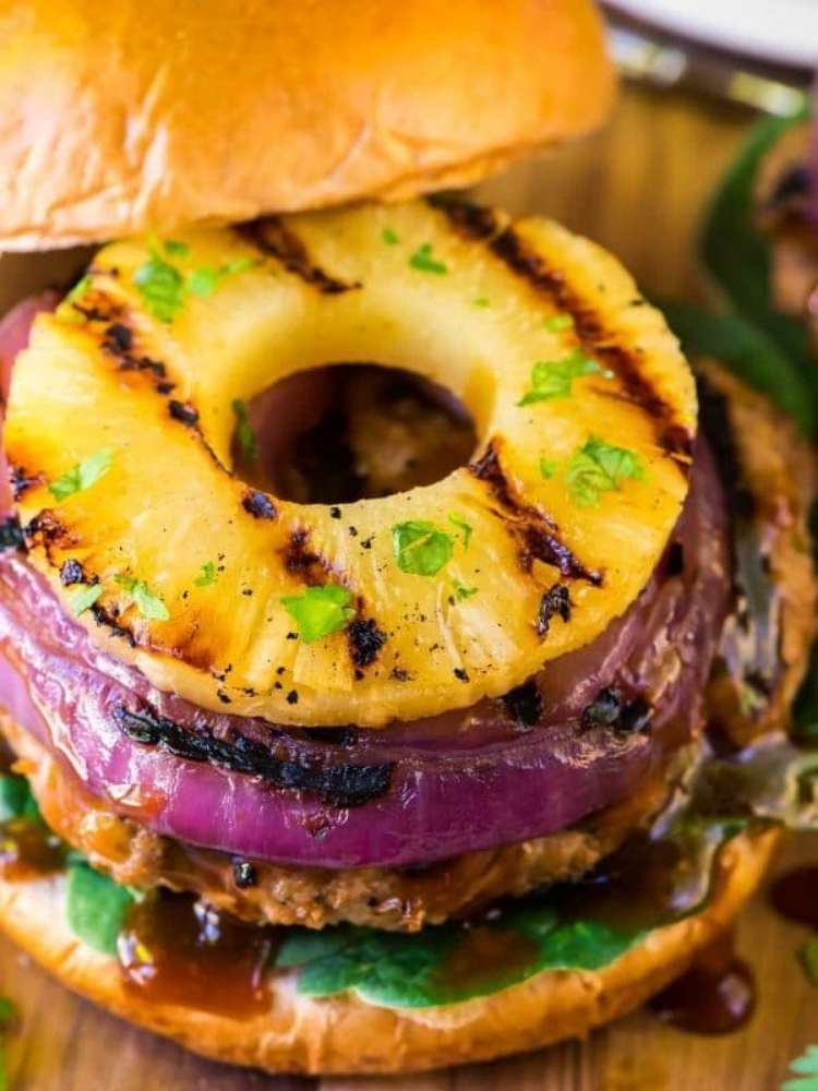 OneCrazyHouse ground turkey recipes teriyaki burger topped with grilled pineapple slice on an open bun with onion and chopped parsley