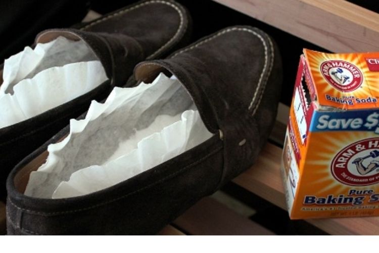 men's black loafers with baking soda and coffee filters