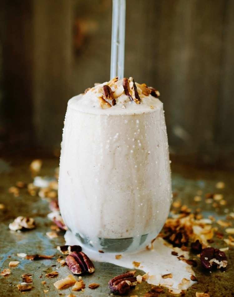 coconut smoothie, smoothie with crushed nuts on top